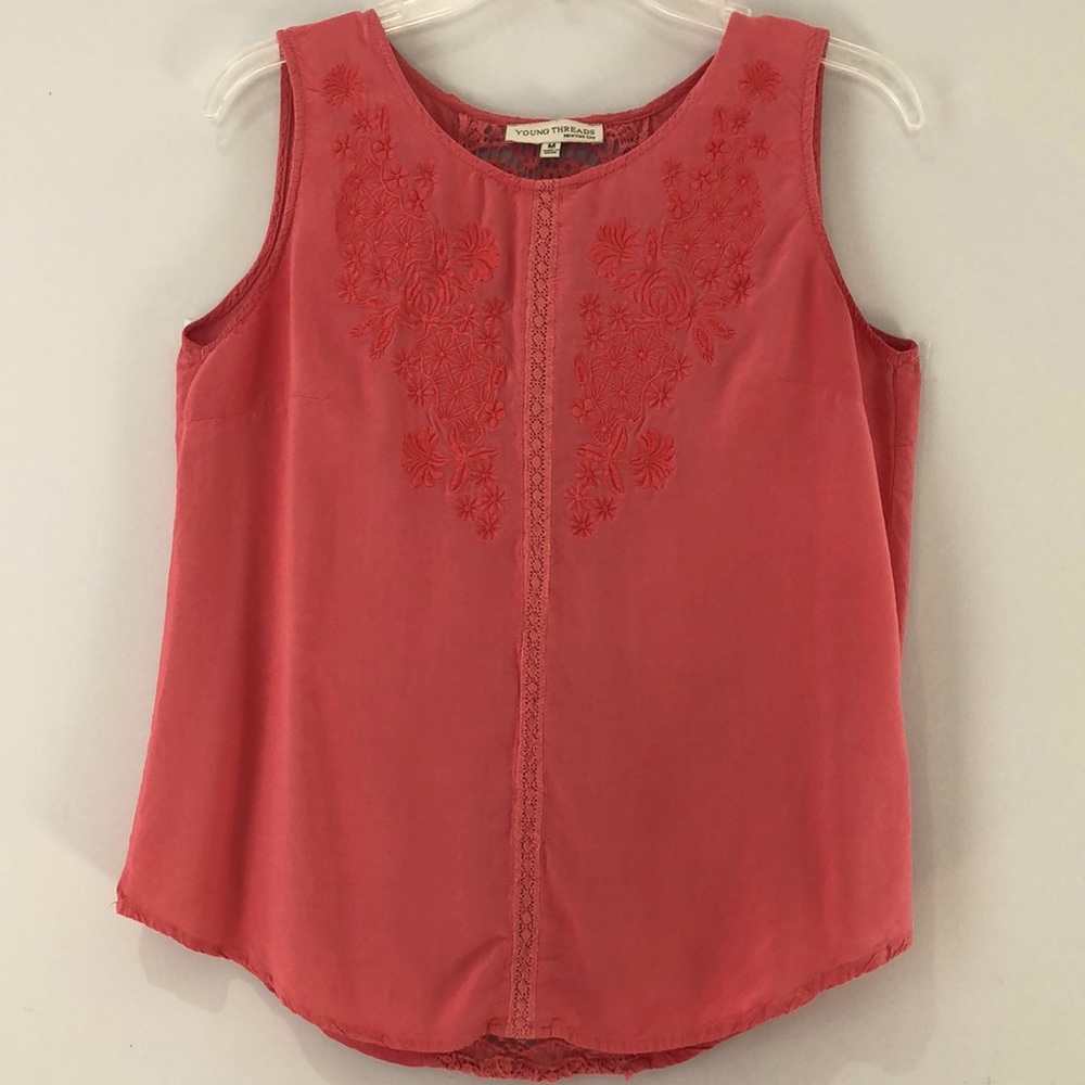 Sleeveless embroidered and open back top. Size M
